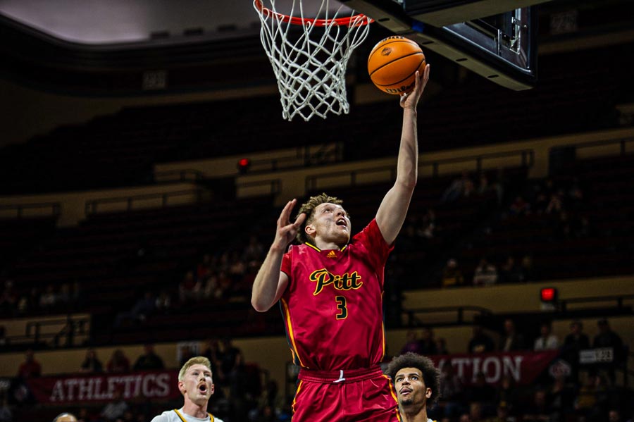 Pittsburg State Basketball Player going for a lay up